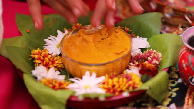 Traditional  wedding ceremony in Hinduism: Turmeric in bowl for haldi ceremony  