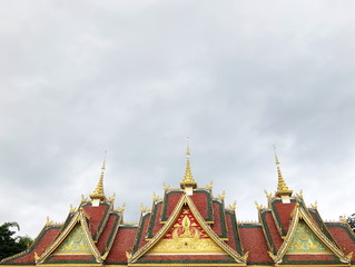 Decorative Thai style golden stucco on the roof of Church in Thai temple