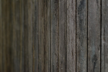 Close up old wooden fence panels. dark tone