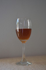 Brandy in wine glass and white background