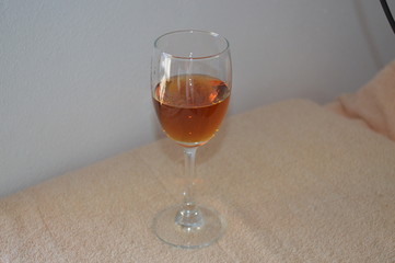 Brandy in wine glass and white background