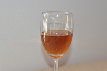 Brandy in wine glass and white background