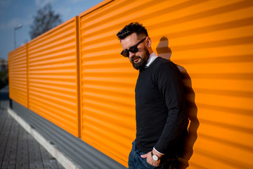 handsome young successful bearded man outdoors