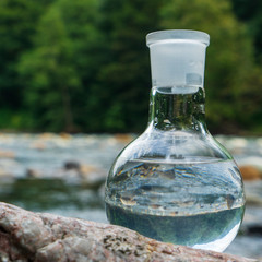Glass flask with clean drinking water.