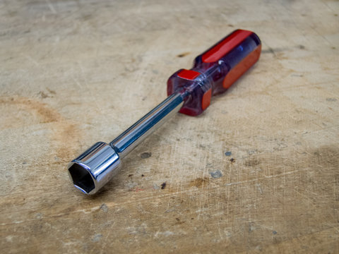 Red and blue nut driver hand tool.