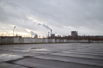 Industrial zone on the outskirts of a big city in autumn
