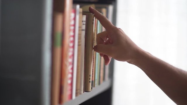 Picking A Book In The Library