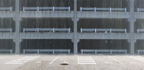 Open floors of multi-level car parking protected by wide steel mesh