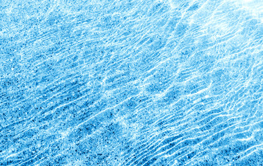 Shining blue water ripple background surface