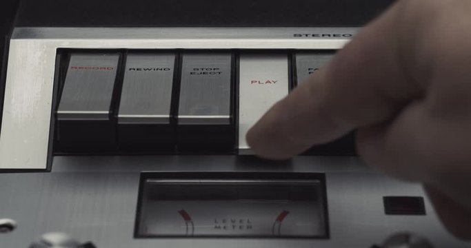 Press play button on retro audio cassette tape player recorder
