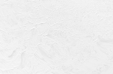 Soft light white fluid paint background with random print splash brush strokes as abstract texture.
