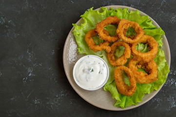 squid rings deep fried with crispy crust.