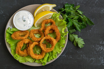squid rings deep fried with crispy crust.