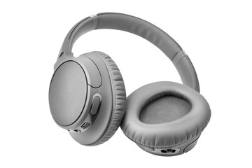 Gray wireless headphones on white background isolated close up, grey bluetooth headset with big...