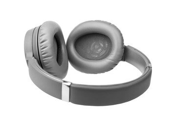 Gray wireless headphones on white background isolated close up, grey bluetooth headset with big leather ear pad cushions design, modern black wi-fi stereo sound earphones side view, audio music device