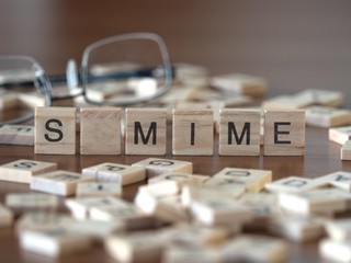 s mime the word or concept represented by wooden letter tiles