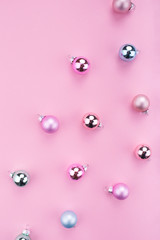 Stylish Christmas baubles decoration on pink background. Flat lay, copy space, top view. Festive decorations 2020 celebration. New Year. Merry Christmas card. 