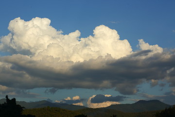 Obraz premium landscape image, large cloud on sky above mountain hill