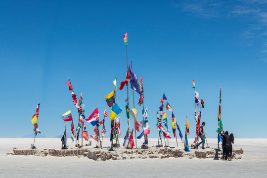 Uyuni, Bolivia, 10-27-2019. Flags at salar de Uyuni the largest salt flat in the world in Bolivia.