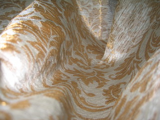 a piece of expensive silk drapery with a pattern, chiaroscuro, macro