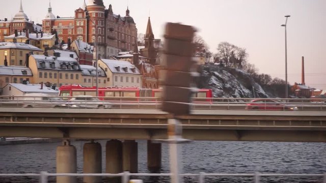 People walking on a busy train station, seen from departing train Slow motion