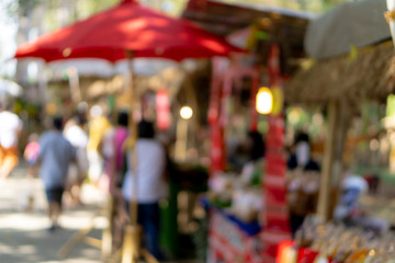 Abstract Blurred image of Chiangmai street market with bokeh for background usage.