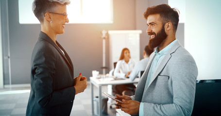 Fototapeta premium Business colleagues having conversation during coffee break