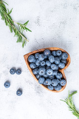 healthy eating antioxidant blueberries in a wooden bowl heart shaped