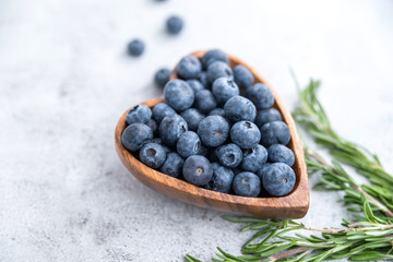 healthy eating antioxidant blueberries in a wooden bowl heart shaped