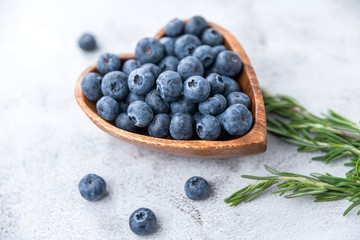 healthy eating antioxidant blueberries in a wooden bowl heart shaped - 308897218