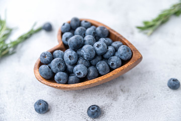 healthy eating antioxidant blueberries in a wooden bowl heart shaped