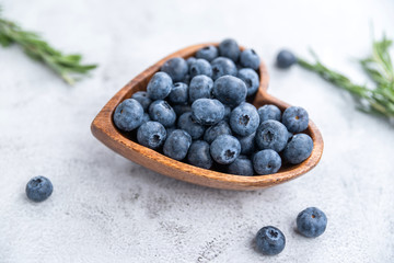 healthy eating antioxidant blueberries in a wooden bowl heart shaped