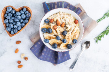 porridge with blueberries banana and nuts top view