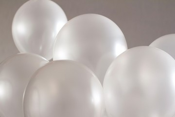 white balloons on grey beige background