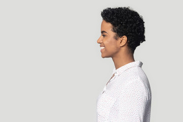 Profile side view happy black woman looking at empty copyspace.