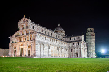 Fototapeta na wymiar Cathedral and leaning tower of Pisa against the night sky on a warm autumn day