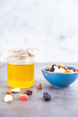 vegetarian snack healthy food nuts and dried fruit with a jar of honey - 308900801