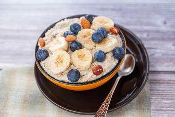 country food oatmeal with nuts and banana