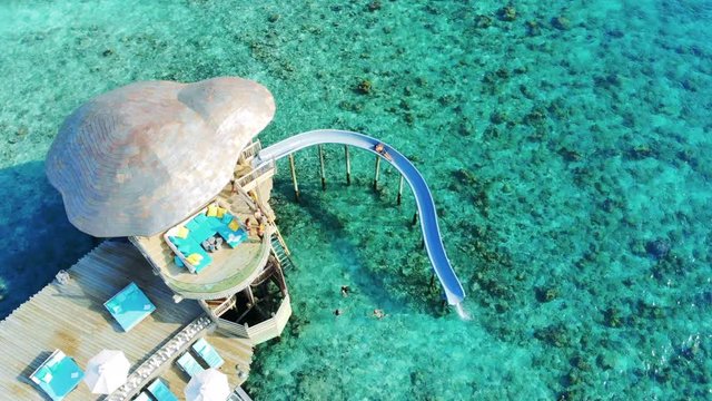 Fun water slide on tropical reef in the Maldives