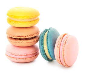 Different tasty macarons on white background