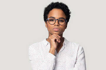 Thoughtful young african american female professional head shot portrait.