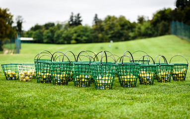 Heap of golf balls in basket ready for warm up.