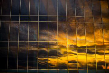 reflection of the sky in the windows in a sbuilding