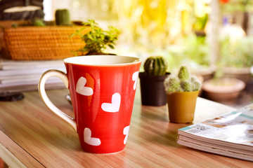 Morning coffee with red coffee heart-shaped heart with the valentine time and morning light at home.