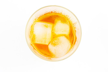 Yellow juice in ice glass