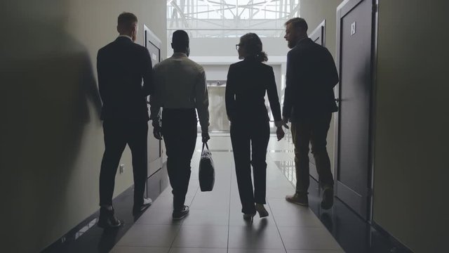 Entrepreneurs entering elevator