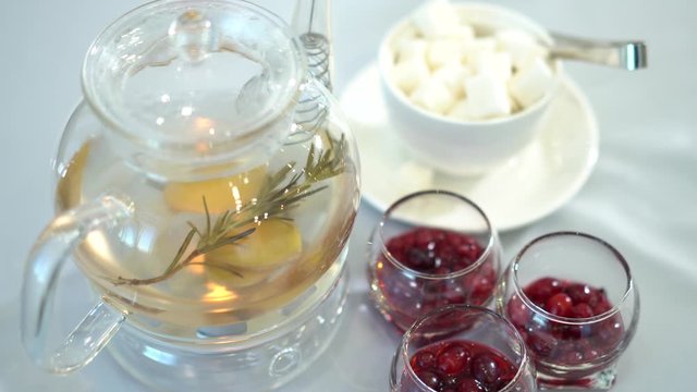 Tea in a heated glass jar awaits its taste.
