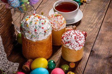 Easter cake and colorful eggs on a dark background
