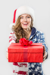 Beautiful santa claus woman with red gift box isolated over white