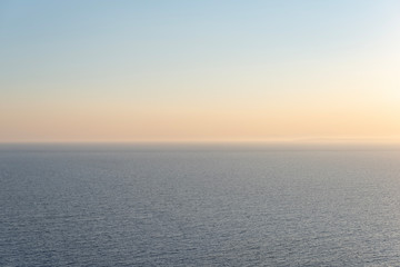 Sunset over sea. The last  sunny rays and blue sea and sky.